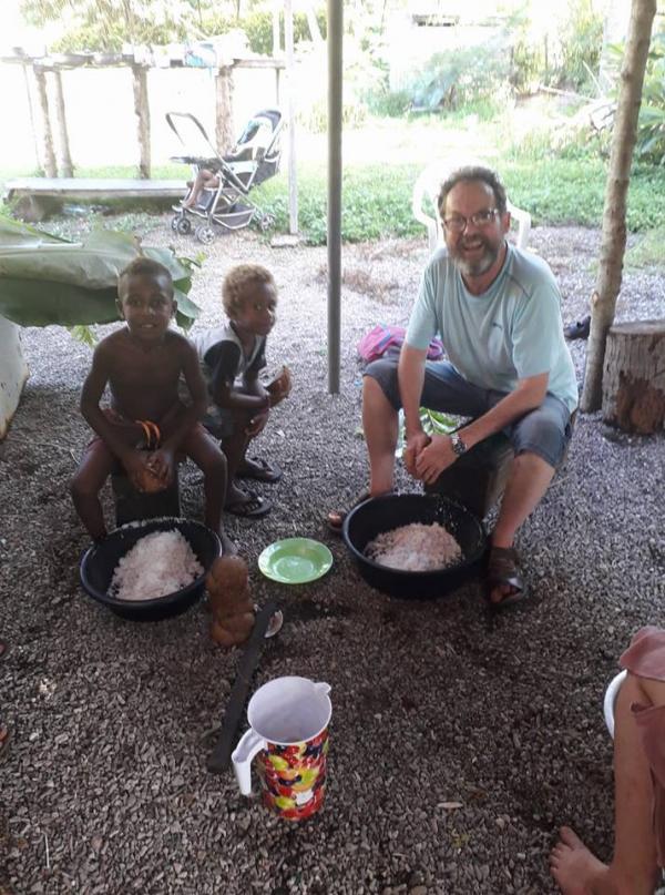 Jeremy and Kevin preparing coconut during our village stay. Both had heart operation scars they proudly showed each other. Jeremy and Kevin Feb 2018